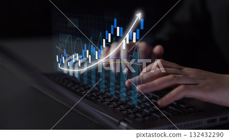 Person Working on Laptop with Financial Graph Analytics and Data Visualization for Investment and Business Concept in Modern Office Environment Copula 132432290