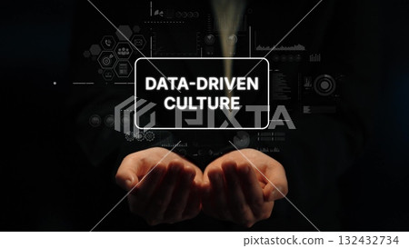 Hands Holding Text Representing Data-Driven Culture with Digital Interfaces and Analytics Graphics. Asymptotic smart data analytic Hands Holding Text Representing Data-Driven Culture with Digital Interfaces and Analytics Graphics. Asymptotic smart data analytic 132432734