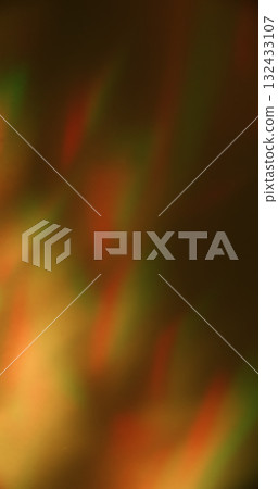Optical glow. Defocused light background. Orange green color rainbow visual glare shadow reflection on warm art illuminated abstraction. Optical glow. Defocused light background. Orange green color rainbow visual glare shadow reflection on warm art illuminated abstraction. 132433107