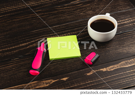 Coffee, stationery, and workspace setup for productivity on a wooden table Coffee, stationery, and workspace setup for productivity on a wooden table 132433779