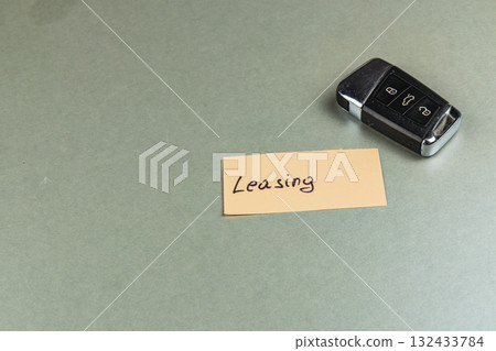 Keys and leasing details on a table in an office setting 132433784