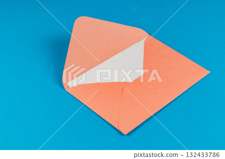 Bright orange envelope on a blue background ready for sending a letter 132433786