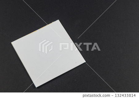 Blank square card on dark surface for various creative uses Blank square card on dark surface for various creative uses 132433814