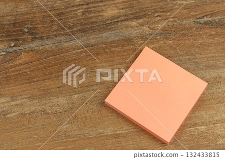 Blank sticky note on wooden table ready for writing ideas Blank sticky note on wooden table ready for writing ideas 132433815