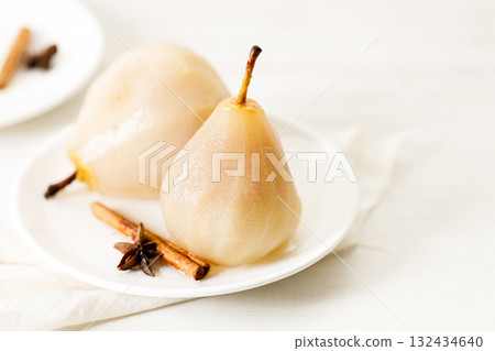 Poached pears with spices in syrup. Poached pears with spices in syrup. 132434640