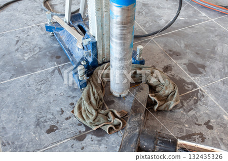 Diamond drill on tripod 132435326