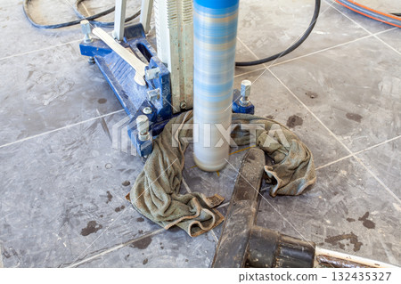 Diamond drill on tripod 132435327