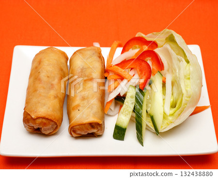 Two Crispy Asian Spring Rolls with Side Salad Two Crispy Asian Spring Rolls with Side Salad 132438880