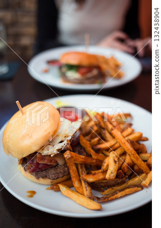 Gourmet Burger with Bacon, Egg, and Crispy Fries Gourmet Burger with Bacon, Egg, and Crispy Fries 132438904