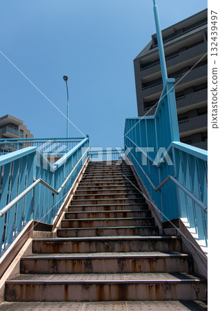 Looking up the stairs towards the blue sky Looking up the stairs towards the blue sky 132439497