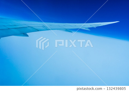 View of the wing from inside a passenger plane View of the wing from inside a passenger plane 132439805