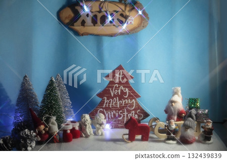 Santa Claus decorating a Christmas tree Santa Claus decorating a Christmas tree 132439839