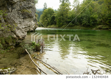 Wild Alpine River with Rocky Shore in Summer Mountains Wild Alpine River with Rocky Shore in Summer Mountains 132440484