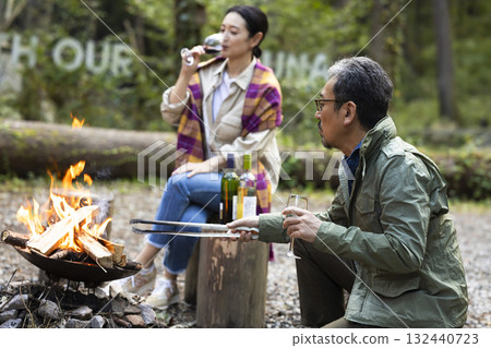 Family having a bonfire at a campsite 132440723