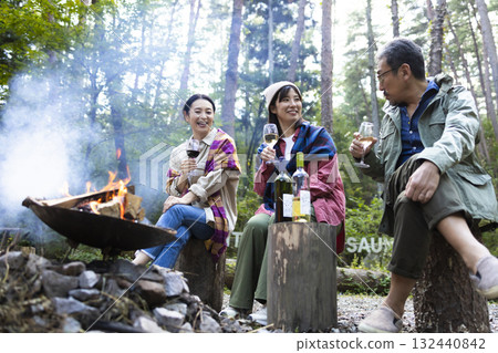 Family having a bonfire at a campsite Family having a bonfire at a campsite 132440842
