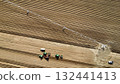 Aerial View of Tractors Preparing Farmland for Planting Season 132441413