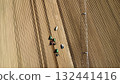 Aerial View of Tractors Preparing Farmland for Planting Season 132441416