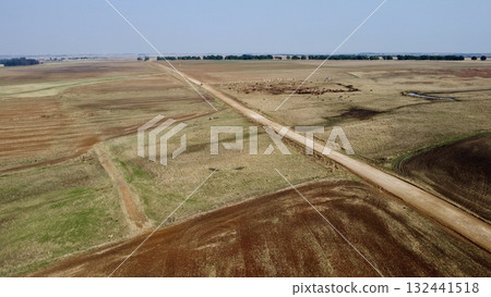 Aerial View of Rural Farmland with Dirt Road and Cattle Grazing in Dry Season 132441518