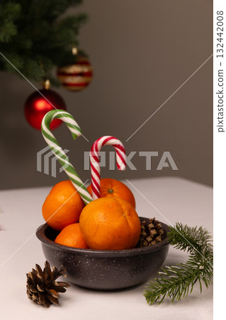 Creative Holiday Decoration With Oranges and Candy Canes for Christmas Celebrations Creative Holiday Decoration With Oranges and Candy Canes for Christmas Celebrations 132442008