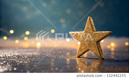Sparkling gold star radiating magical Christmas spirit against dreamy bokeh background, perfect for holiday greetings and festive designs 132442255