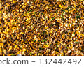 Colorful autumn leaves creating a vibrant textured ground cover 132442492