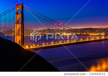 San Francisco Golden Gate Bridge sunset through cables San Francisco Golden Gate Bridge sunset through cables 132443531