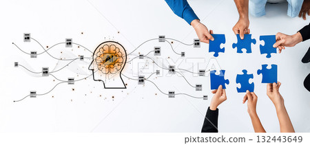 Collaborative effort in artificial intelligence concept with hands holding puzzle pieces and a brain illustration on a light background showcasing teamwork and innovation Trope 132443649