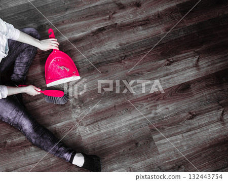 Cleaning woman sweeping wooden floor 132443754