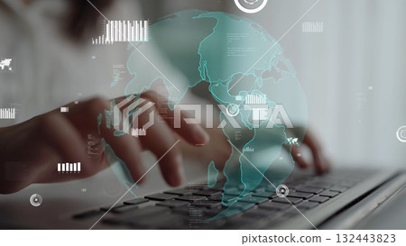 Hands Typing on Laptop with Digital Globe and Data Graphics Overlay Representing Global Connectivity and Technology in Modern Business Environment xenic 132443823