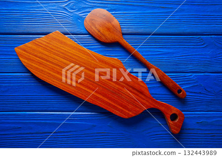 Chef tool spatula and table board on blue Chef tool spatula and table board on blue 132443989