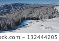 Breathtaking aerial drone revealing serene winter beauty snow covered mountain peaks, dense white blanketed forest, cozy houses nestled among frosty trees. Winter wild nature travel background Breathtaking aerial drone revealing serene winter beauty snow covered mountain peaks, dense white blanketed forest, cozy houses nestled among frosty trees. Winter wild nature travel background 132444205