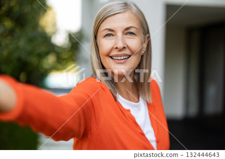 Portrait picture of a mature blonde woman feeling good and positive Portrait picture of a mature blonde woman feeling good and positive 132444643