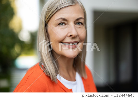 Portrait picture of a mature blonde woman feeling good and positive Portrait picture of a mature blonde woman feeling good and positive 132444645