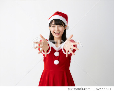 A young Japanese woman dressed as Santa Claus smiling and spreading her arms (full body, white background) A young Japanese woman dressed as Santa Claus smiling and spreading her arms (full body, white background) 132444824