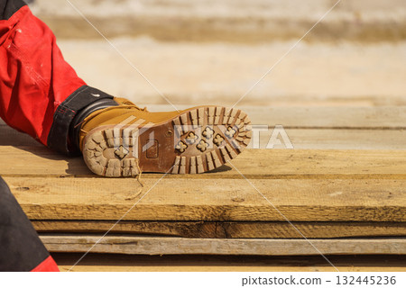 Person wearing red worker trousers Person wearing red worker trousers 132445236
