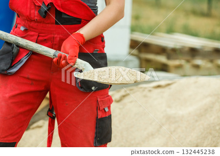 Person using shovel on construction site Person using shovel on construction site 132445238