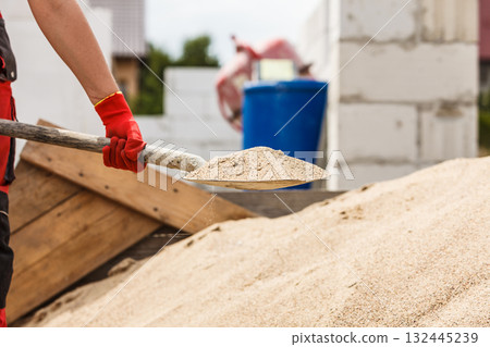 Person using shovel on construction site Person using shovel on construction site 132445239
