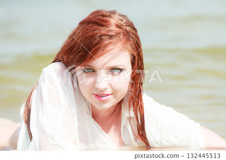 Sensual girl wet cloth in water on the coast. Sensual girl wet cloth in water on the coast. 132445513
