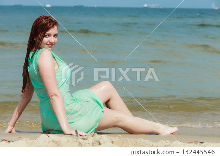 Sensual girl wet cloth in water on the coast. 132445546