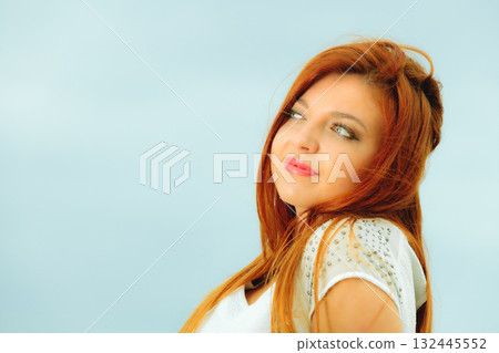 Beautiful redhaired girl on beach, portrait 132445552