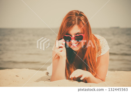 Woman on sandy beach 132445563
