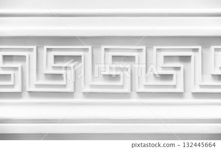 Decoration with white Meander motif. Classic wall moulding, vintage style interior Decoration with white Meander motif. Classic wall moulding, vintage style interior 132445664