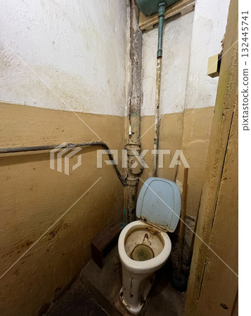 Toilet bowl stained with feces and urine in an old communal apartment Toilet bowl stained with feces and urine in an old communal apartment 132445741