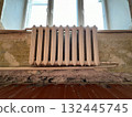 Old cast-iron radiator in apartment that is undergoing renovation 132445745