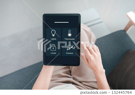 Smart Home Control. User managing devices with tablet interface. 132445764