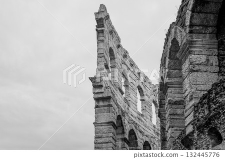 Monochrome detail of Verona Arena shows surviving double arcade from original outer wall structure 132445776