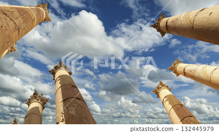 Roman Columns in the Jordanian city of Jerash (Gerasa of Antiquity), capital and largest city of Jerash Governorate, Jordan. Against the background of a beautiful sky with clouds 132445979