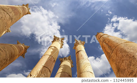 Roman Columns in the Jordanian city of Jerash (Gerasa of Antiquity), capital and largest city of Jerash Governorate, Jordan. Against the background of a beautiful sky with clouds Roman Columns in the Jordanian city of Jerash (Gerasa of Antiquity), capital and largest city of Jerash Governorate, Jordan. Against the background of a beautiful sky with clouds 132445995