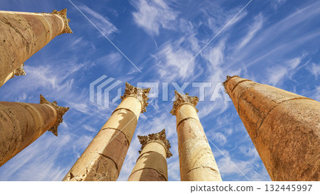 Roman Columns in the Jordanian city of Jerash (Gerasa of Antiquity), capital and largest city of Jerash Governorate, Jordan. Against the background of a beautiful sky with clouds 132445997