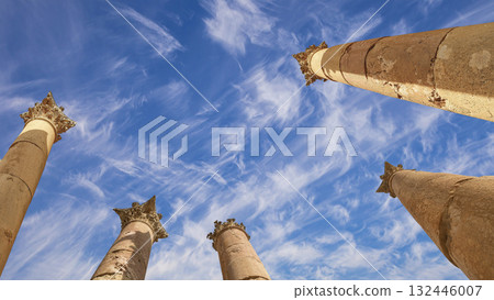 Roman Columns in the Jordanian city of Jerash (Gerasa of Antiquity), capital and largest city of Jerash Governorate, Jordan. Against the background of a beautiful sky with clouds 132446007